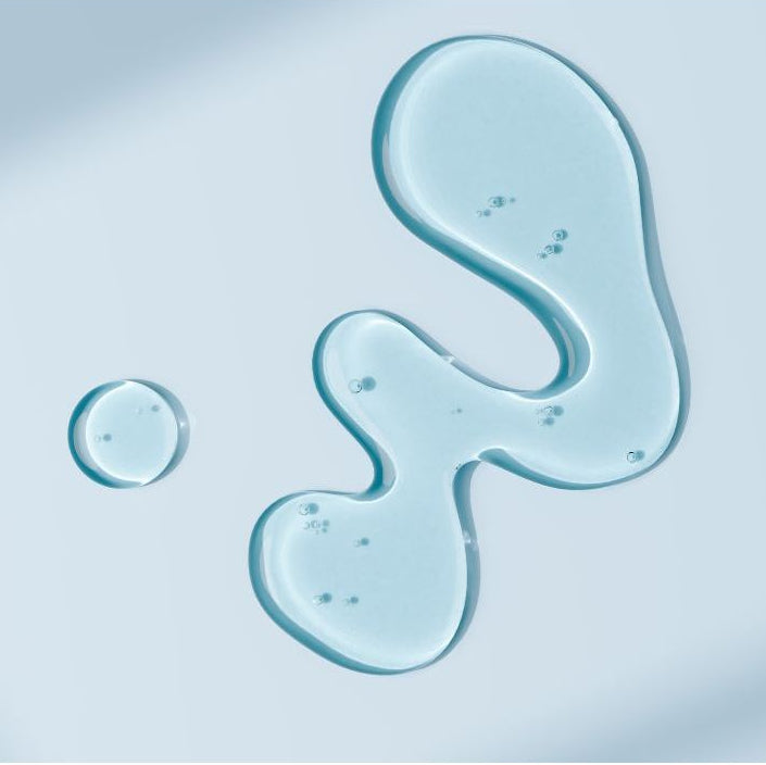 Blue gel-like substance with 'New Day Organics Balance Serum' text on a light blue background