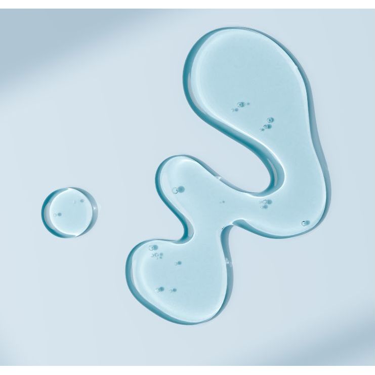 Blue gel-like substance with 'New Day Organics Balance Serum' text on a light blue background