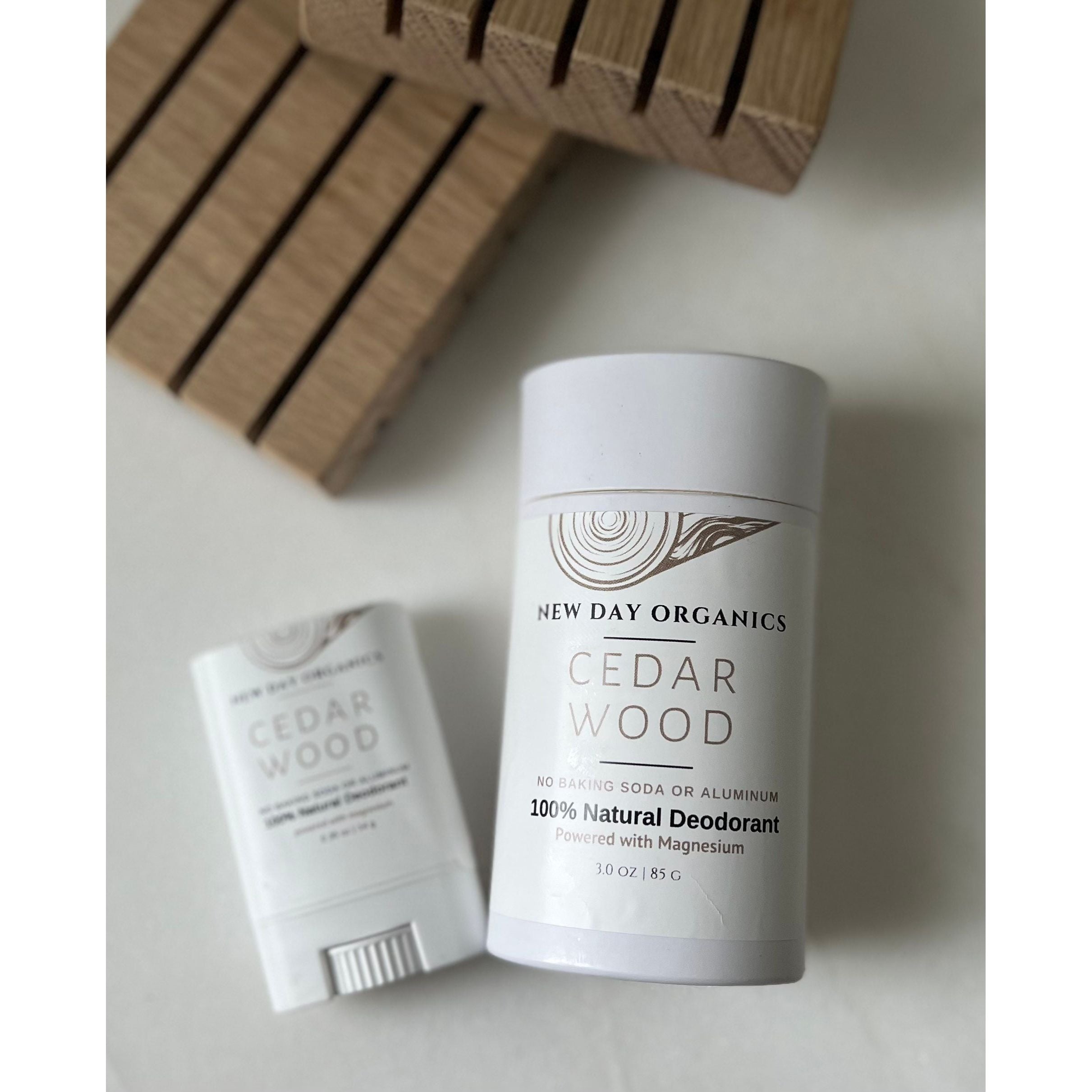New Day Organics Cedar Wood deodorant on a light background