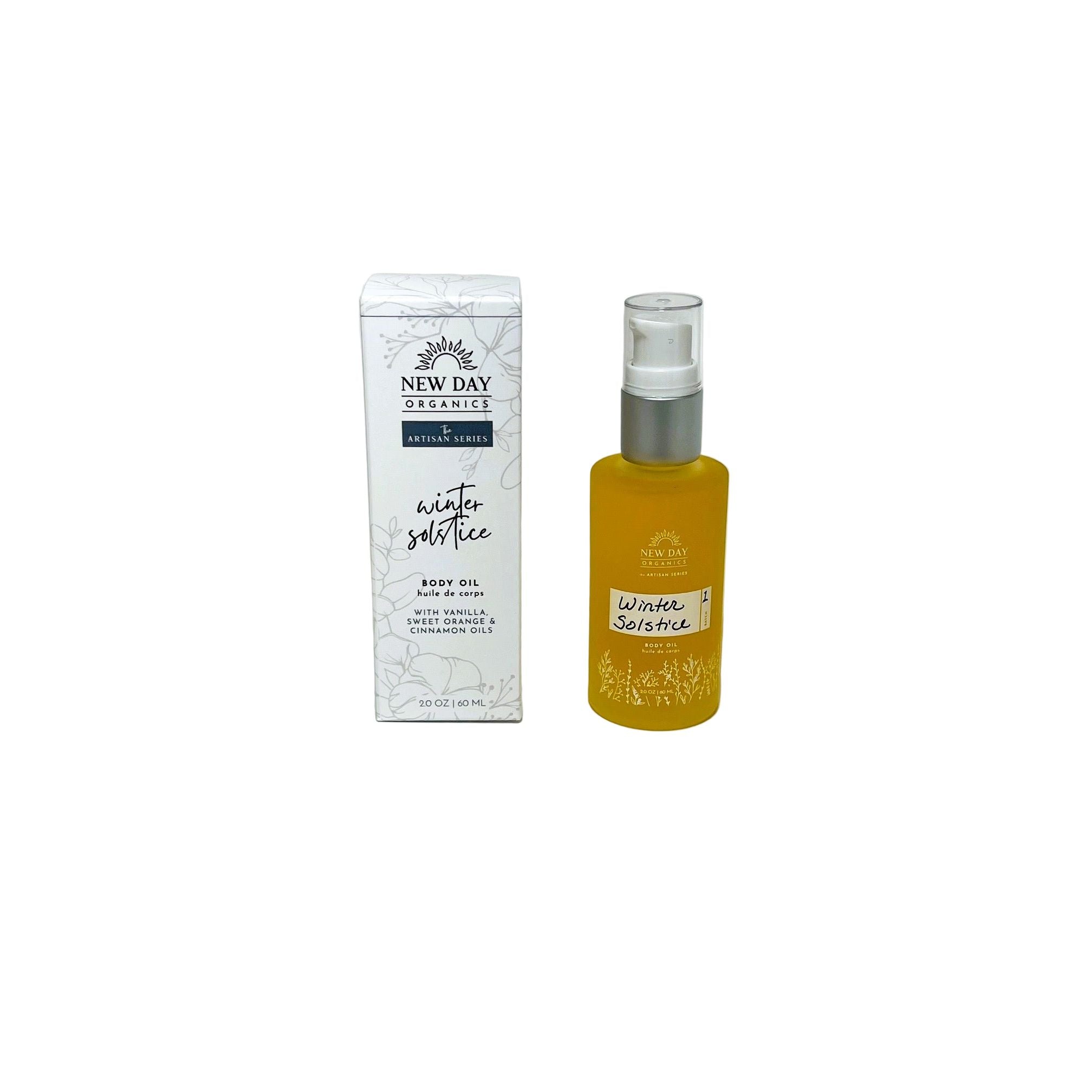New Day Organics body oil and winter salve on a white background