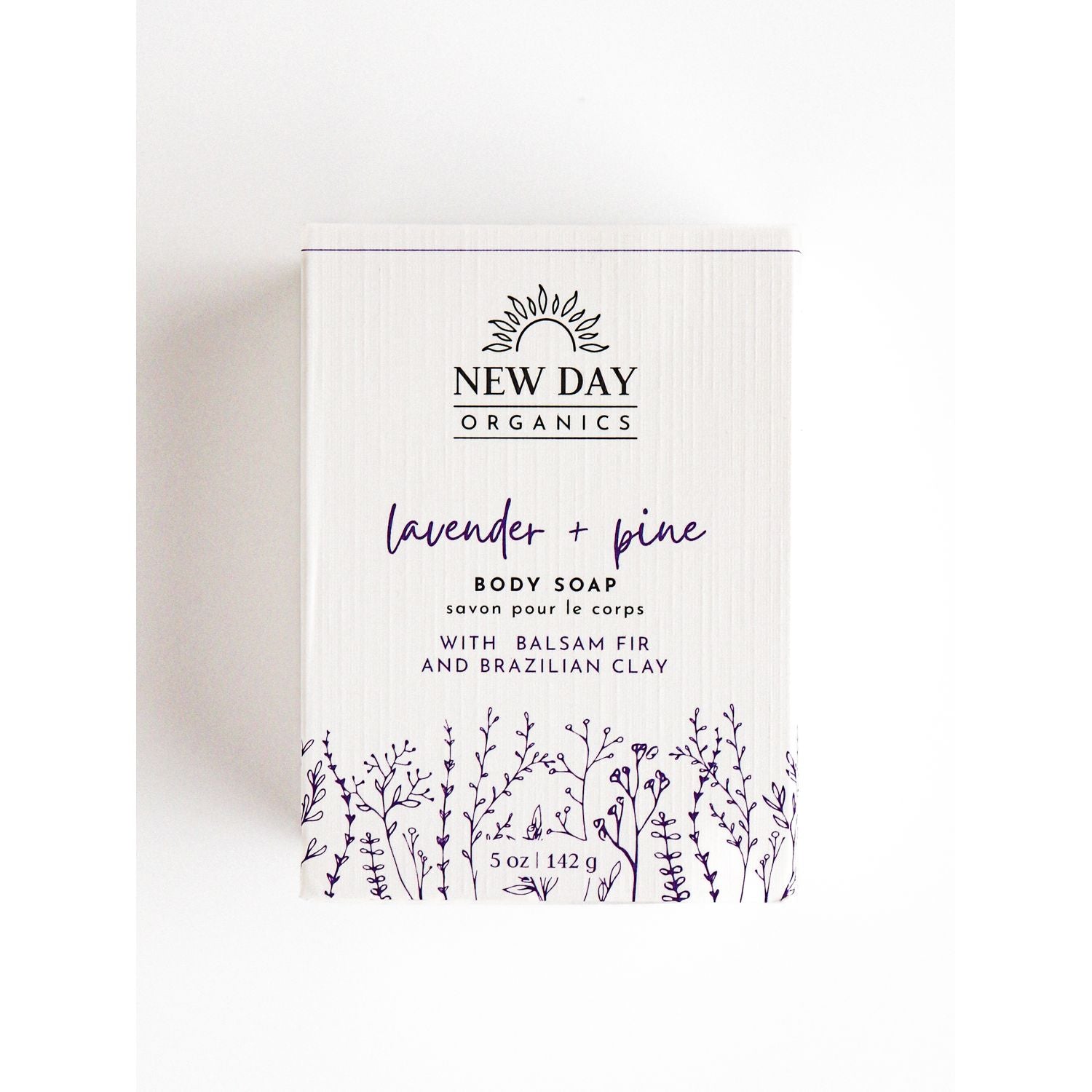 New Day Organics lavender and pine body soap packaging on a white background