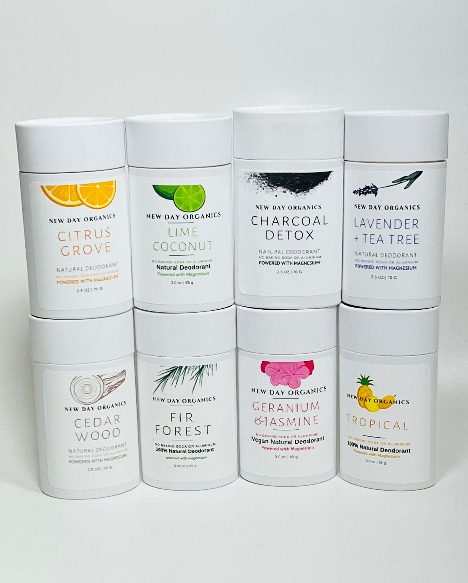 Collection of New Day Organics deodorant containers on a white background